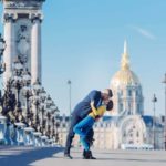 Emily and her husband kissing on the Alexander III bridge