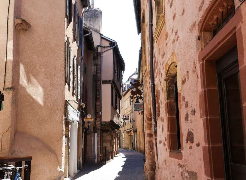 Medieval street in the city of Rodez with caracteristic red stone