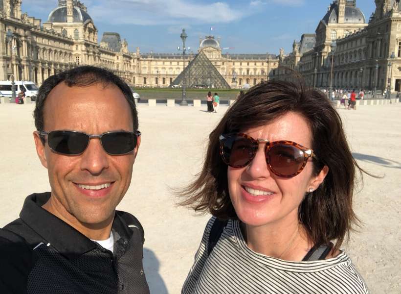 David and his wife in the courtyard of the Louvre