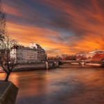The banks of the Seine River around Ile de la Cité at sunset