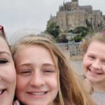 Kimberly and her daughters in front of the Mont Saint Michel: Women World Cup Trip Report episode