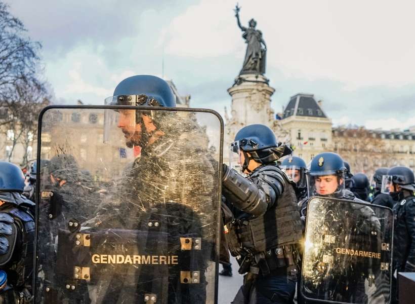 police in paris wearing riot gear