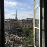 Open window with view towards the Eiffel Tower
