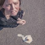 Woman looking sad that she dropped her ice cream cone: 3 common mistakes tourists make in Paris episode