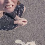 Woman looking sad that she dropped her ice cream cone: 3 common mistakes tourists make in Paris episode