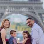 Michelle and family posing in front of the Eiffel Tower: Paris with Preschoolders episode