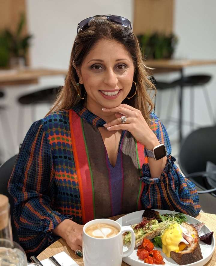 Deepa enjoying a meal at a restaurant