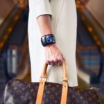 Woman carrying a Louis Vuiton bag: Haute Couture in Paris episode
