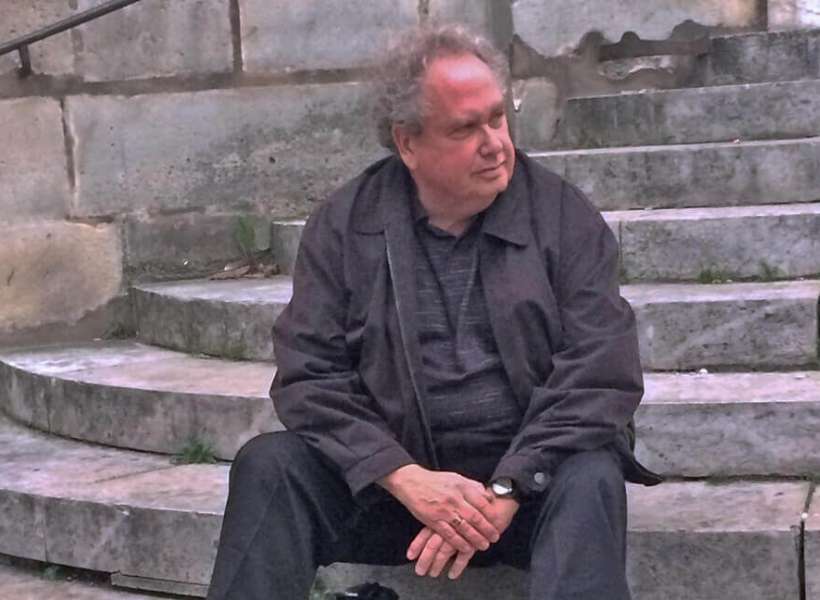 Phil sitting on the steps of Saint Etienne du Mont: Latin Quarter Episode