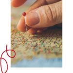 Woman placing a pin on a map: Best Practices When Preparing a Trip to France episode