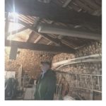 Wendy's husband looking inside an old barn: House Hunting in France episode