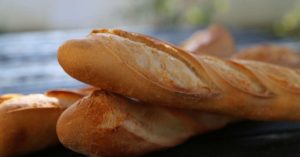 Baguettes on a table: Bread in France episode