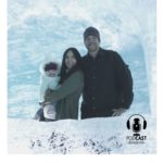 Jessica with her husband and baby inside of an ice cave: French Alps with a Baby episode
