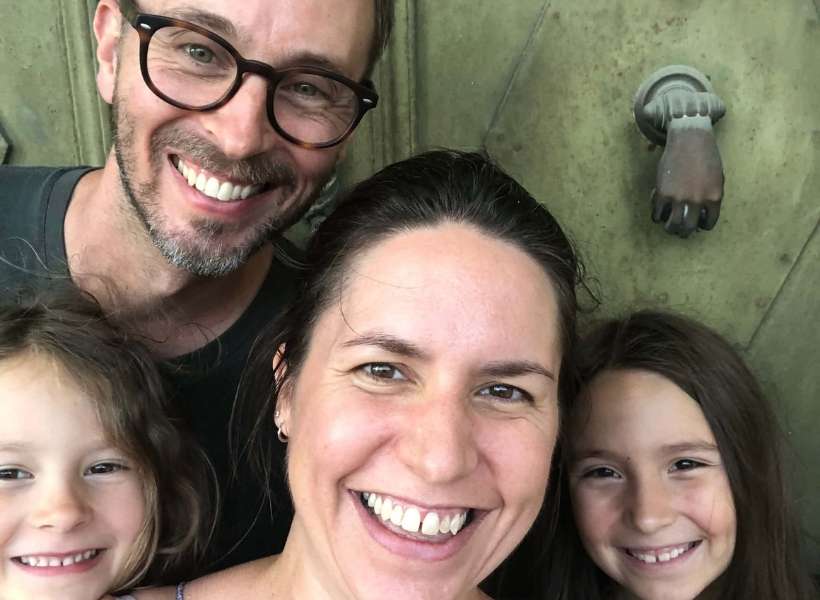 Georgia's family in front of their new home in France