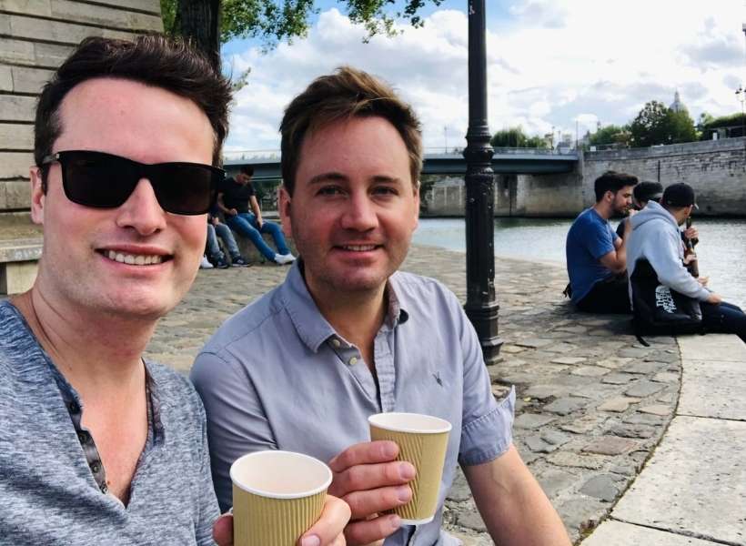 Scott and Grant sitting on Place Arragon in Paris