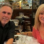 Joni and Steve Goldin sitting at a restaurant in Paris: first time in Paris trip report episode