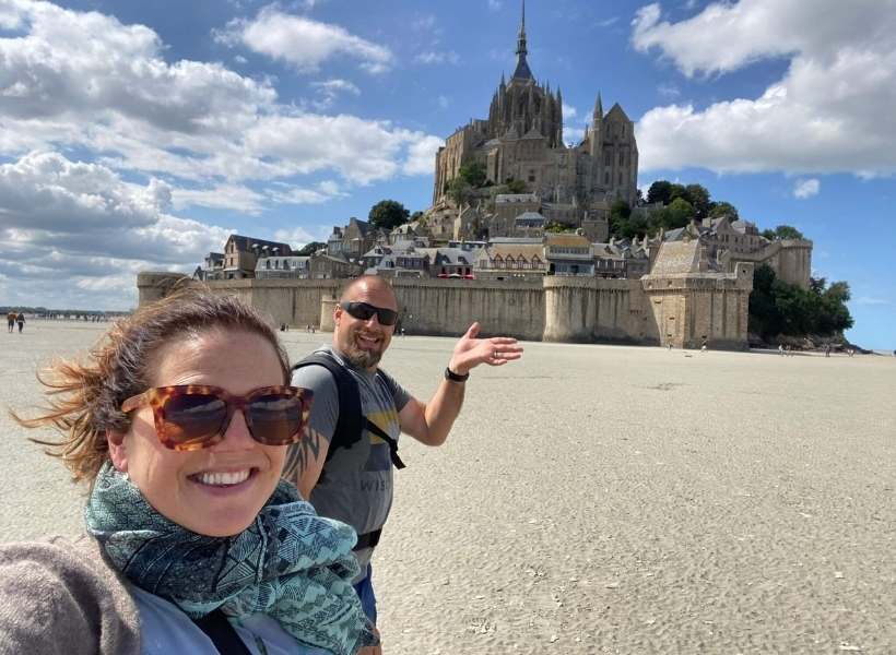 Heidi and her husband at the Mont Saint Michel: a month in France on a budget episode