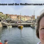 Jennifer in front of a canal and boats: Narbonne and the Meditarranean Coast Episode