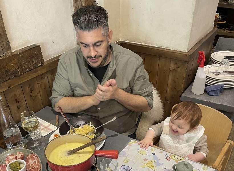 Eddie and baby daughter eating Cheese Fondue: France with a baby episode