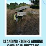 Elyse Rivin standing by a Dolmen in the Carnac area