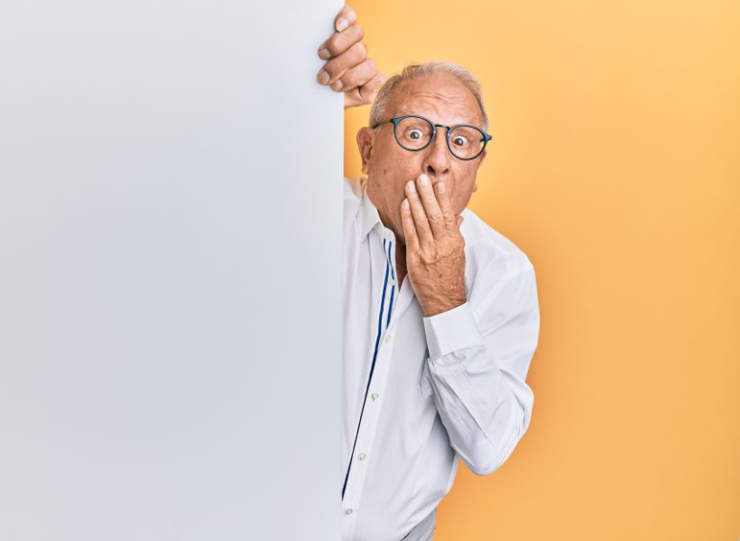 Man with his hand in front of his face: rookie mistakes visitors make in France