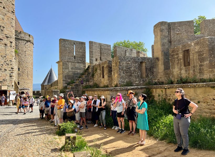 France Bootcamp 2023, group listening to Elyse in Carcassonne