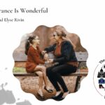 Woman and girl sitting on a park bench and conversing happily: Why life in France is wonderful episode