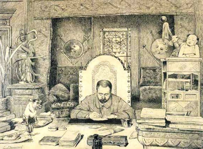 Emile Zola sitting at his desk