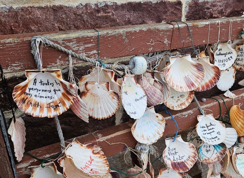 Hikers deposit shells: Brittany Coastal Camping Guide: GR34 from Saint-Brieuc to Saint-Malo Episode